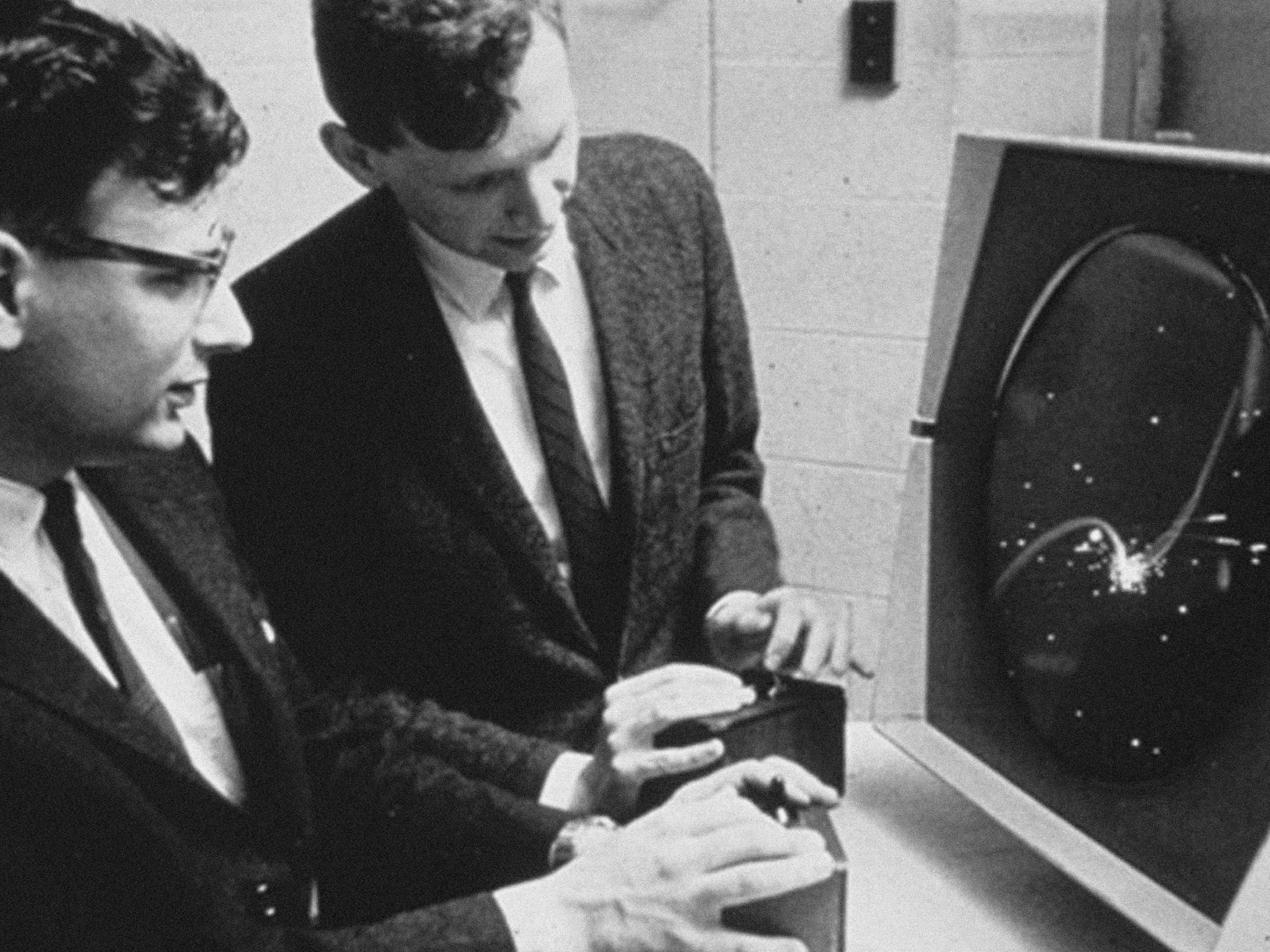 Dan Edwards and Peter Samson playing Spacewar! on the PDP-1 Type 30 Display.